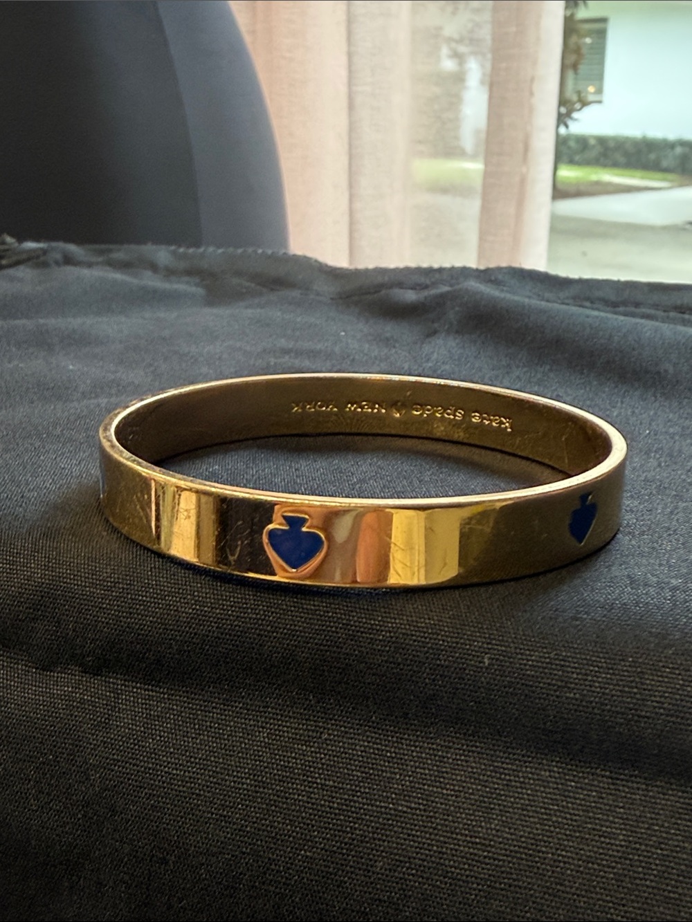 kate spade gold bangle with blue heart details
